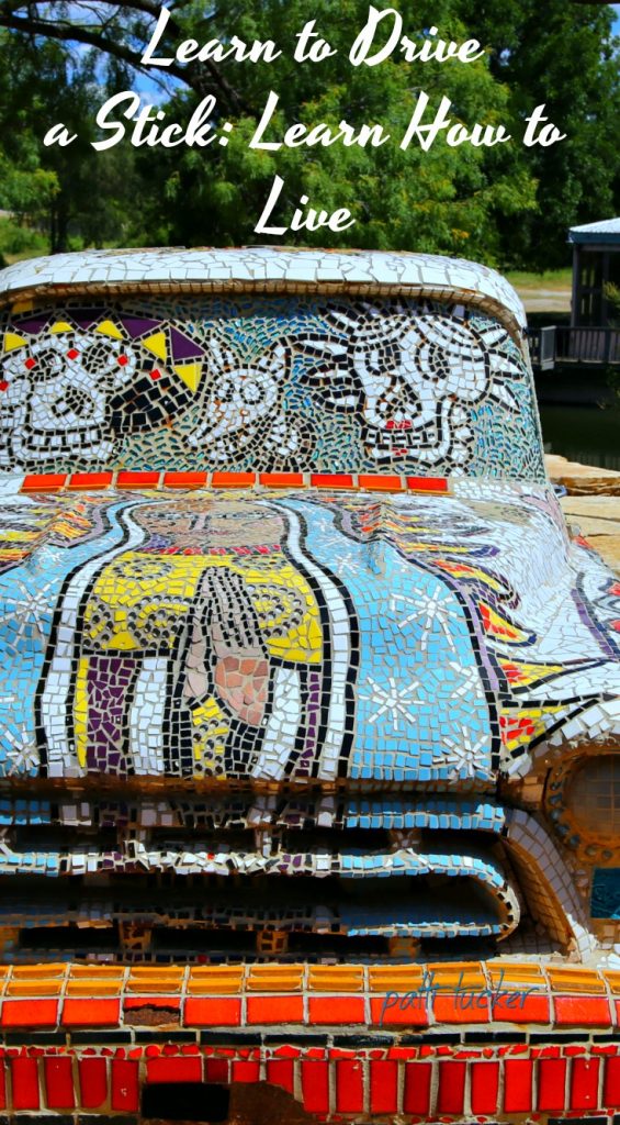 Life is Like Learning How To Drive a Stick graphic with a mosaiced truck and text