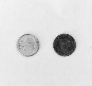 One shiny dime and one dirty dime on white background